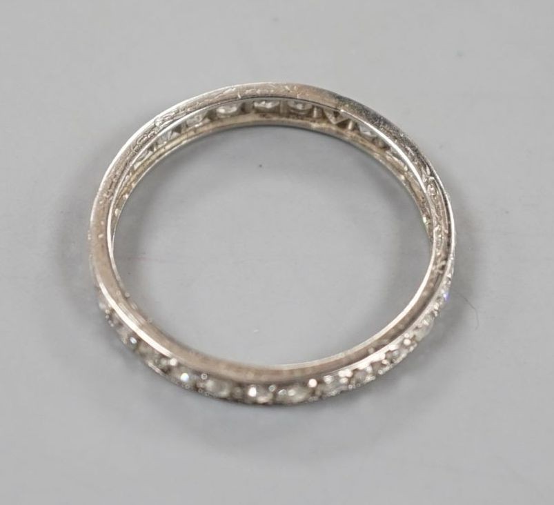 A white metal and diamond set full eternity ring, size Q, gross weight 2 grams.